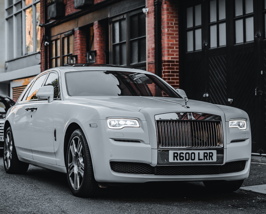 Rolls-Royce wedding chauffeur car in London dressed with ribbon