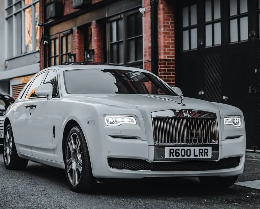 Rolls-Royce wedding chauffeur car in London dressed with ribbon